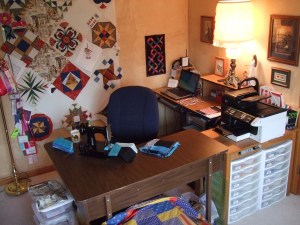 Sewing Table set-up with plastic bins for class handouts under the printer.